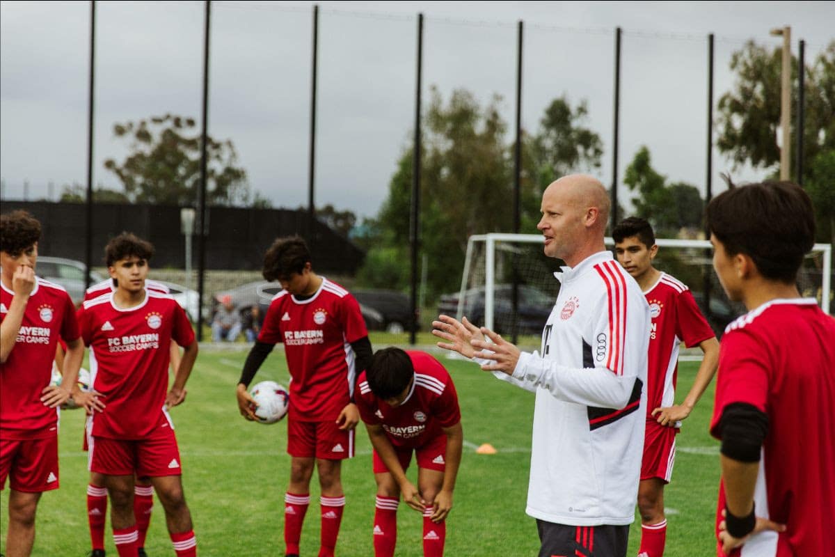 Bayern Munich coach and young soccer players
